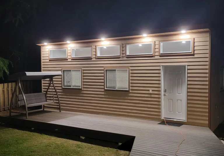 Backyard studio with exterior LED lighting and composite deck